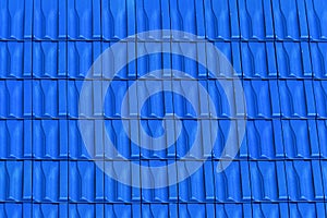 Roof with metallic blue tiles.