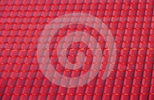 Roof with metallic red tiles.