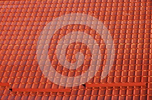 Roof with metallic red tiles.