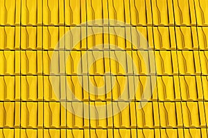 Roof with metallic yellow tiles.