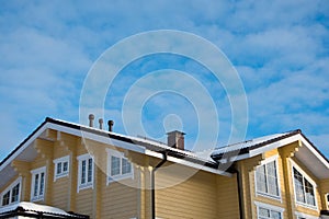 Roof modern cottage on a blue sky background