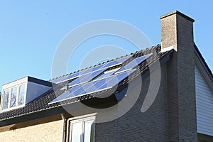 Roof of modern house with alternative solar panel energy, Netherlands