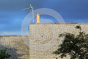 Roof, new chimney, aerial and sky.