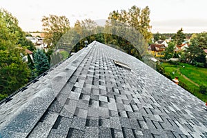 Roof of new house with shingles roof-tiles