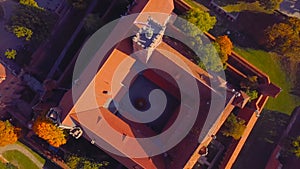 The roof of an old building in Poland. The color of the wall is red in the traditional style photo