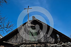 Roof of the old house against the blue sky