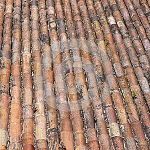 Roof of red old grunge weathered tiles