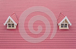 roof with red tiles of house with white window