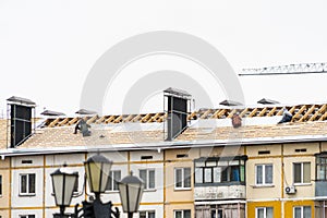 Roof repair in an apartment building. Work at height