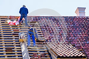 Roof repair of a historic house and replacement of clay tiles