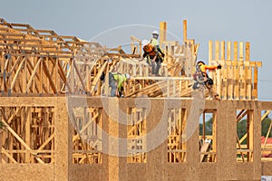 Roof repair on rooftop. Construction worker install new roof. Construction worker roofing on a large roof apartment