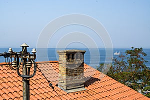 Roof with sea in background