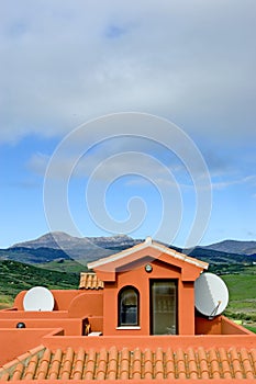 Roof of Spanish apartment with tv satellite dish