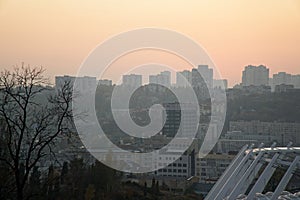 Roof of stadium and cityscape behind on city background. Soccer stadium