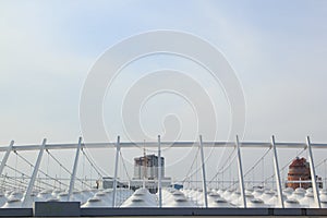 The roof of the stadium under the blue sky