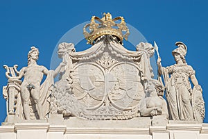 Roof statues of Imperial symbols and coat of arms at Alberina museum, near Palmenhaus and Neue Burg Palace garden in historical