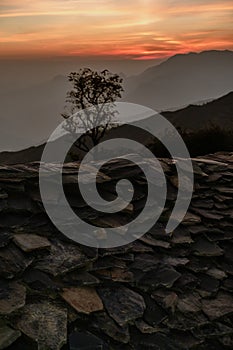 Roof of a stone hut crafted from flat, quarried rocks in the stunning landscapes of Tehri Garhwal, Himalayan Uttarakhand