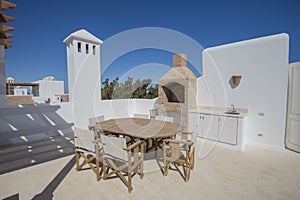 Roof terrace balcony with dining table in luxury villa