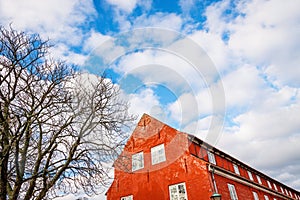 Roof terracotta color barrack in Kastellet Fortress and cloudy sky. Copenhagen, Denmark