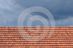 Roof tile pattern over blue sky