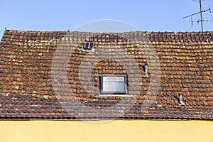 Roof tile pattern over blue sky
