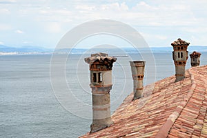 Roof tiles and chimneys on Duino castle.
