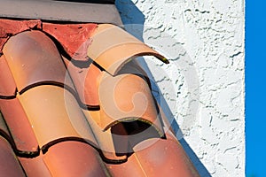 Roof tiles dislodged by strong winds during storm