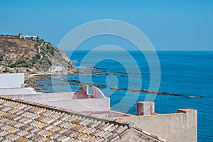 Roof tiles overlooking the mediterranean sea and ruins of La Caleta, Tarifa SPAIN photo