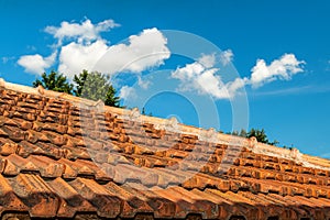 Roof tiles. Roofing texture. Red corrugated tile element of roof