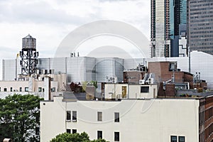 Roof top of buildings and an old water tank in New York City, USA