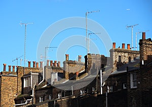 Roof top with chimneys and antennas