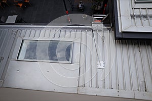 Roof top safety fall arrest anchor point plate permanently attached into first man up line