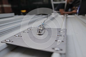 Roof top safety fall arrest anchor point plate permanently attached into first man up line photo