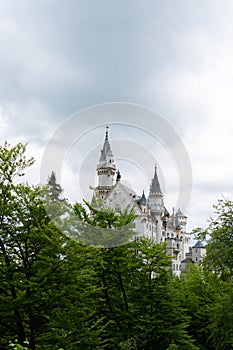 Roof and towers of Neuschwanstein castle in Fussen Germany. Schloss Neuschwanstein. New Swanstone Castle . Summer