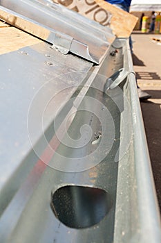 Roof under construction. Close up of zinc rain gutter