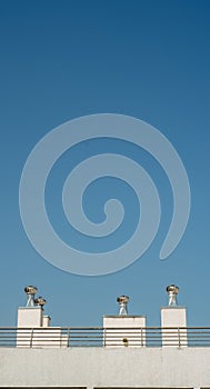 roof ventilators against a blue sky