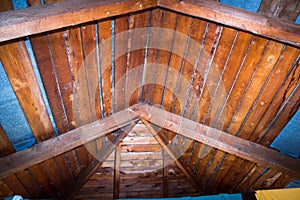 Roof view from the inside,wooden roof rafters inside, metal roofing