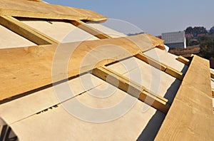 Roof Waterproofing Membrane Coverings. Wooden Construction Home Framing with Roof Rafters.