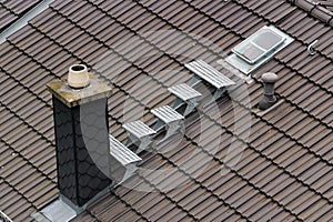 Roof window and metal steps for chimney maintenance and cleaning