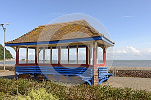 Roofed blue bench at Minehead, Somerset