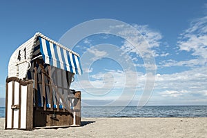 Roofed wicker beach chair