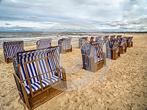 Roofed wicker beach chairs