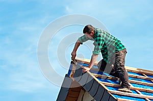 Roofer Attaching Shingles photo