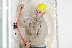 roofer builder worker using special pliers