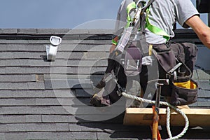 Roofer construction roof repair rope security worker