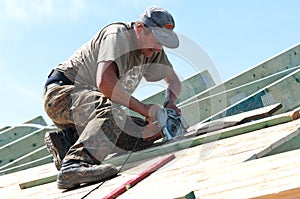 Roofer with Electric Saw