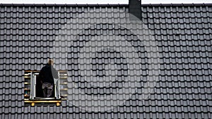 Roofer installing loft window