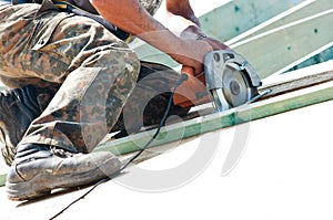 Roofer with rotary drill photo