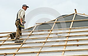 Roofer at work on roof