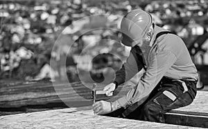 Roofer working. Roofer working tool. Construction Industry and Waterproofing. roofer working on roof structure of